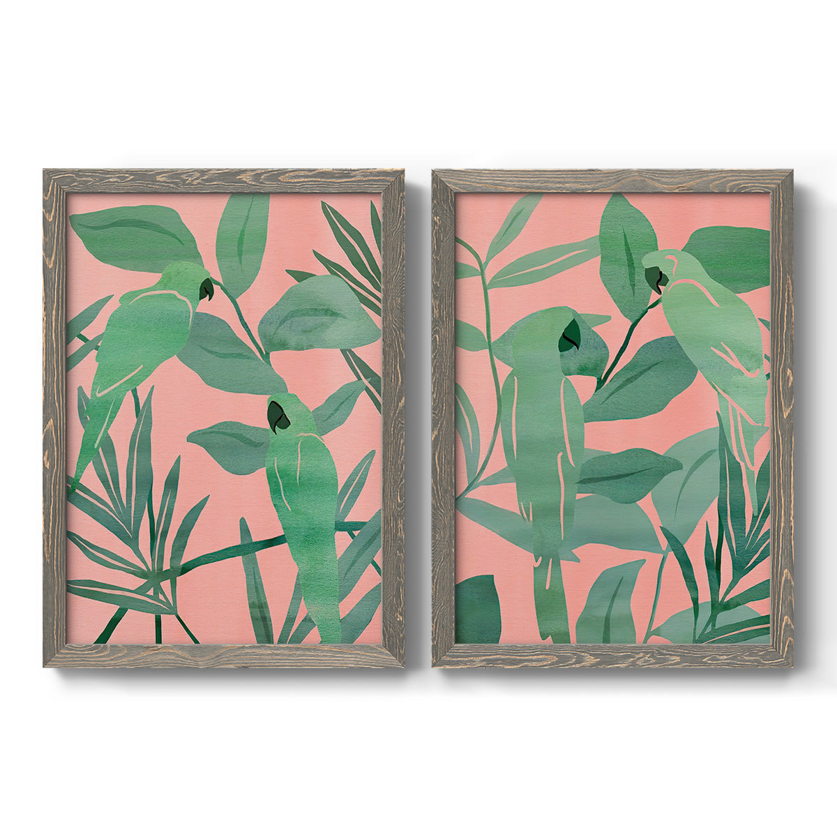 Set of two gray barnwood framed canvas prints featuring two bold tropical botanical prints featuring large green tropical leaves on coral-pink grounds.