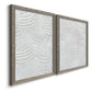 Angled view of a set of two gray barnwood framed canvas prints featuring two textural monochrome abstracts featuring overlapping white carved arcs and ridges.