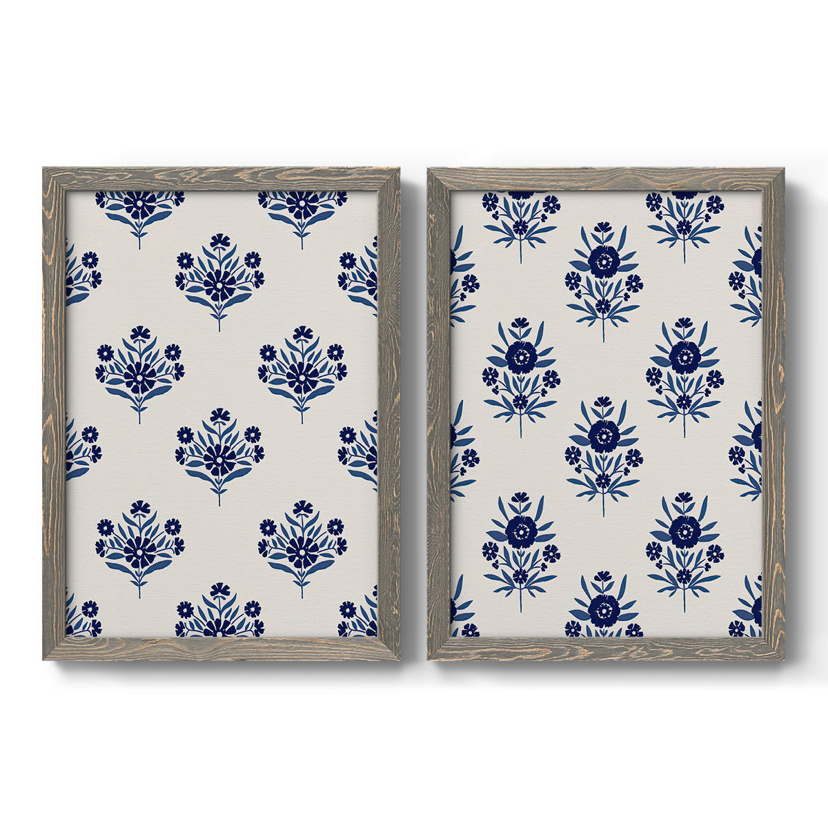 Set of two gray barnwood framed canvas prints featuring two repeating blue floral patterns with stylized bouquets arranged across warm white backgrounds.