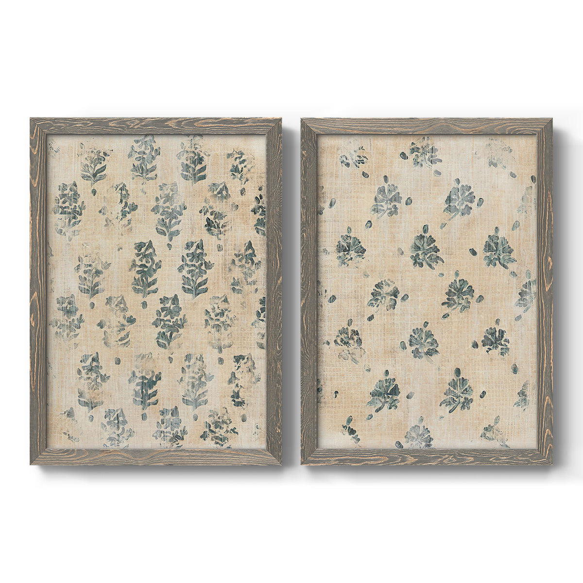 Set of two gray barnwood framed canvas prints featuring two weathered block-print patterns featuring small repeating blue floral motifs.