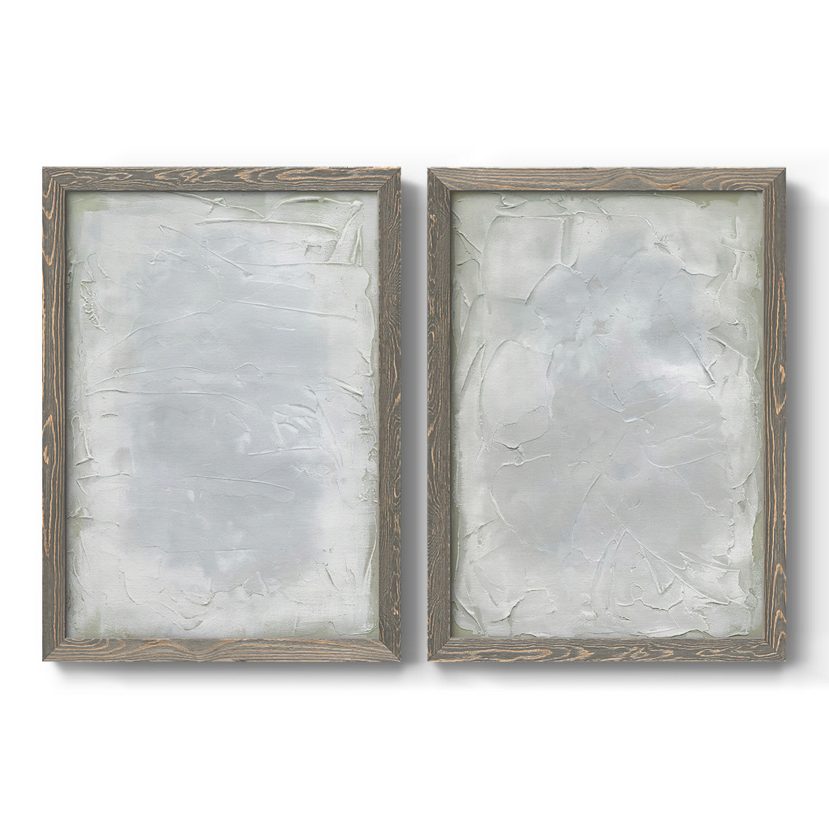 Set of two gray barnwood framed canvas prints featuring two quiet textural abstracts featuring layered white and silver-gray painted surfaces.