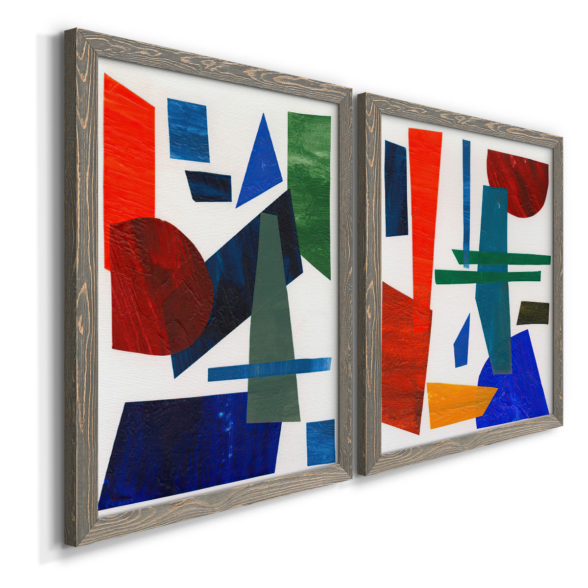 Angled view of a set of two gray barnwood framed canvas prints featuring two mid-century graphic abstracts featuring bold red blue green yellow and black geometric forms.