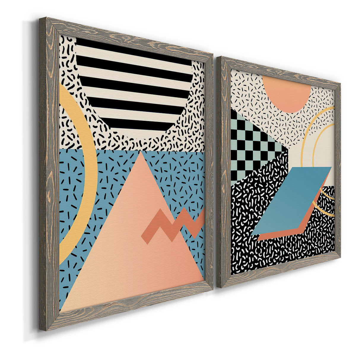 Angled view of a set of two gray barnwood framed canvas prints featuring two retro graphic abstracts featuring bold geometric Memphis-style patterns.