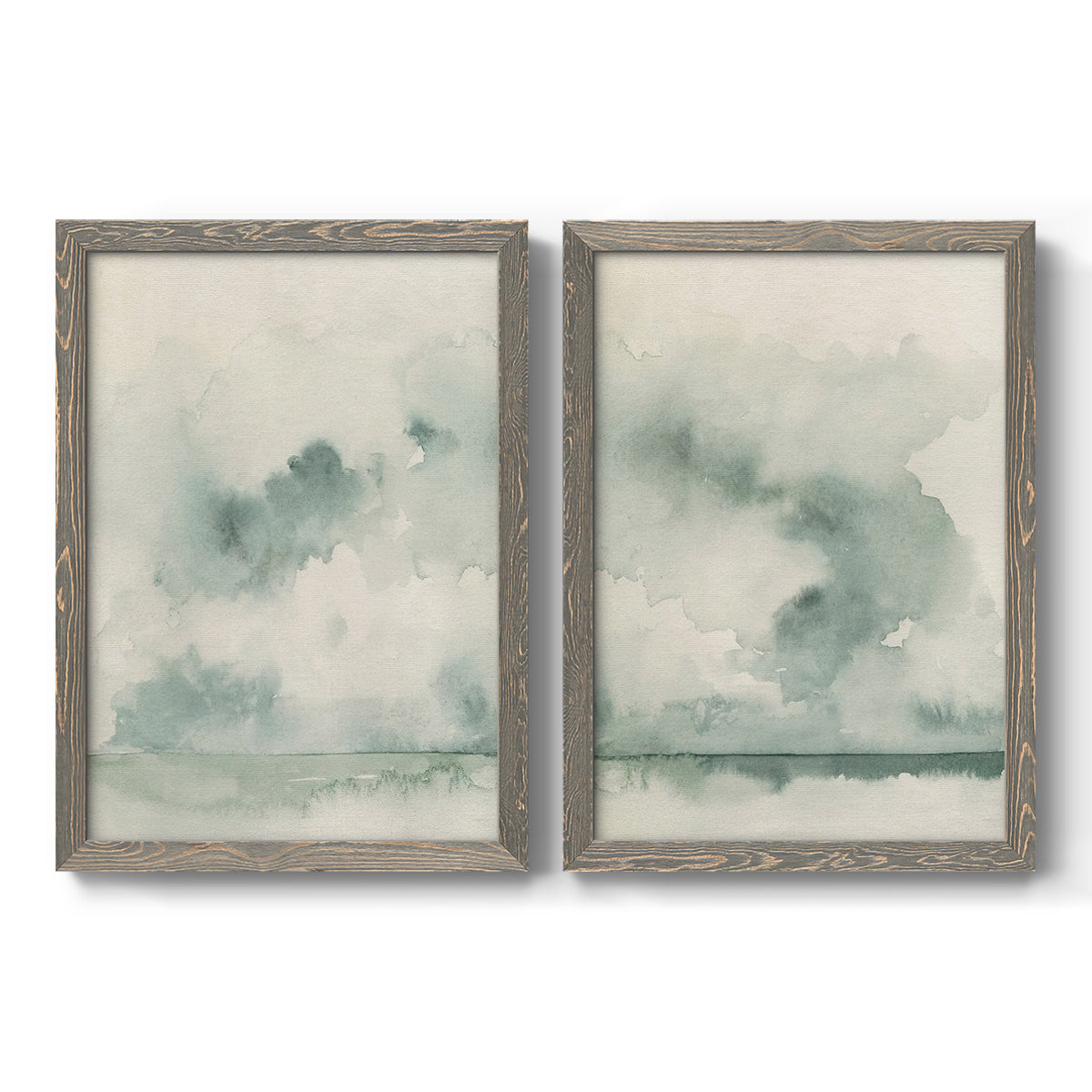 Set of two gray barnwood framed canvas prints featuring two minimalist watercolor seascapes with misty green clouds calm horizons and pale reflective water.