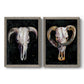 Set of two gray barnwood framed canvas prints featuring two dramatic Western animal paintings featuring ram and cattle skulls against black grounds.