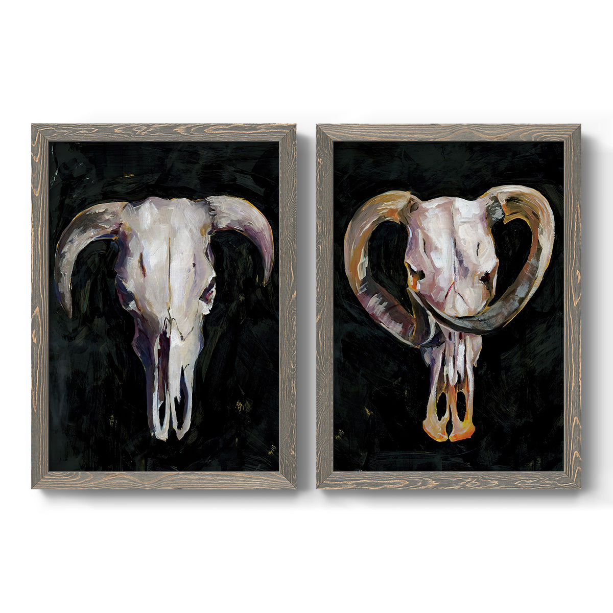 Set of two gray barnwood framed canvas prints featuring two dramatic Western animal paintings featuring ram and cattle skulls against black grounds.