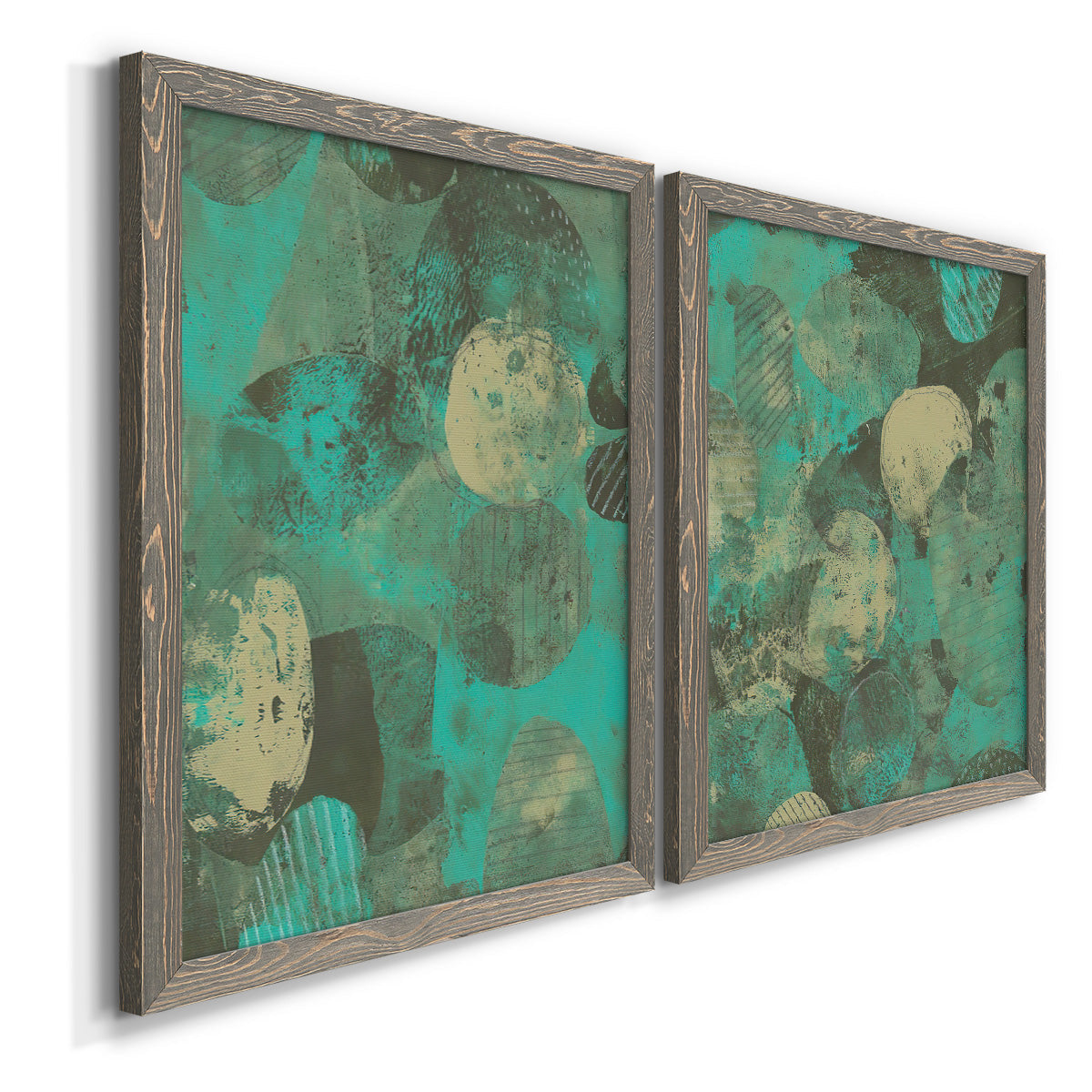 Angled view of a set of two gray barnwood framed canvas prints featuring two textured organic abstracts featuring layered mint teal and beige circular forms.