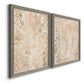 Angled view of a set of two gray barnwood framed canvas prints featuring two vintage decorative prints featuring ornate cream floral damask patterns.