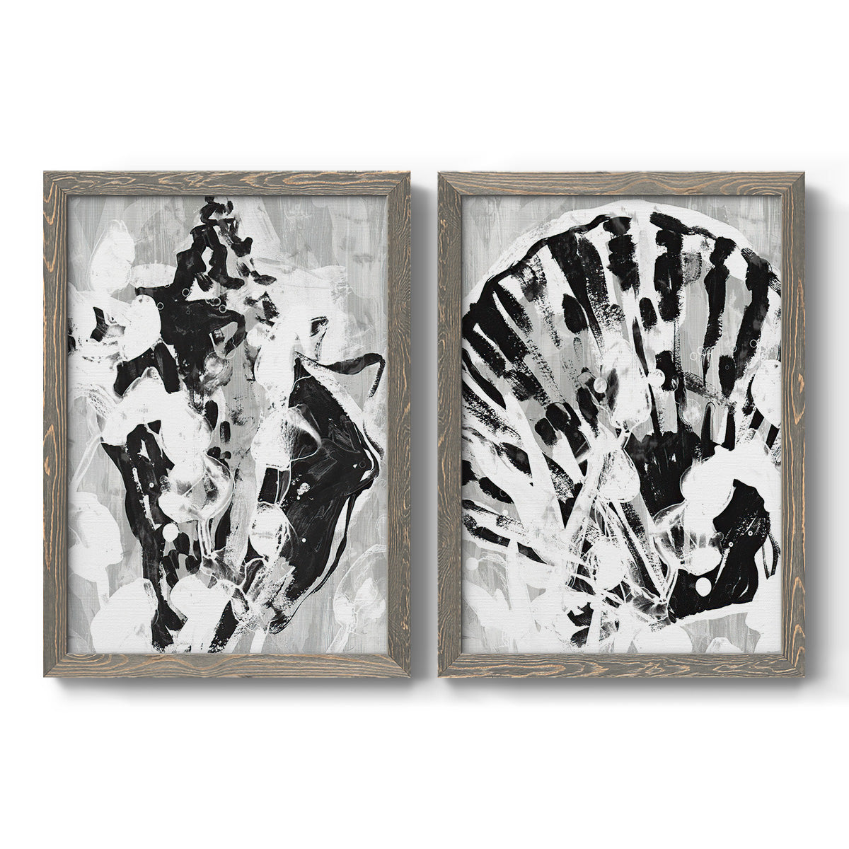 Set of two gray barnwood framed canvas prints featuring two dramatic monochrome abstracts featuring black and gray inkblot bursts.