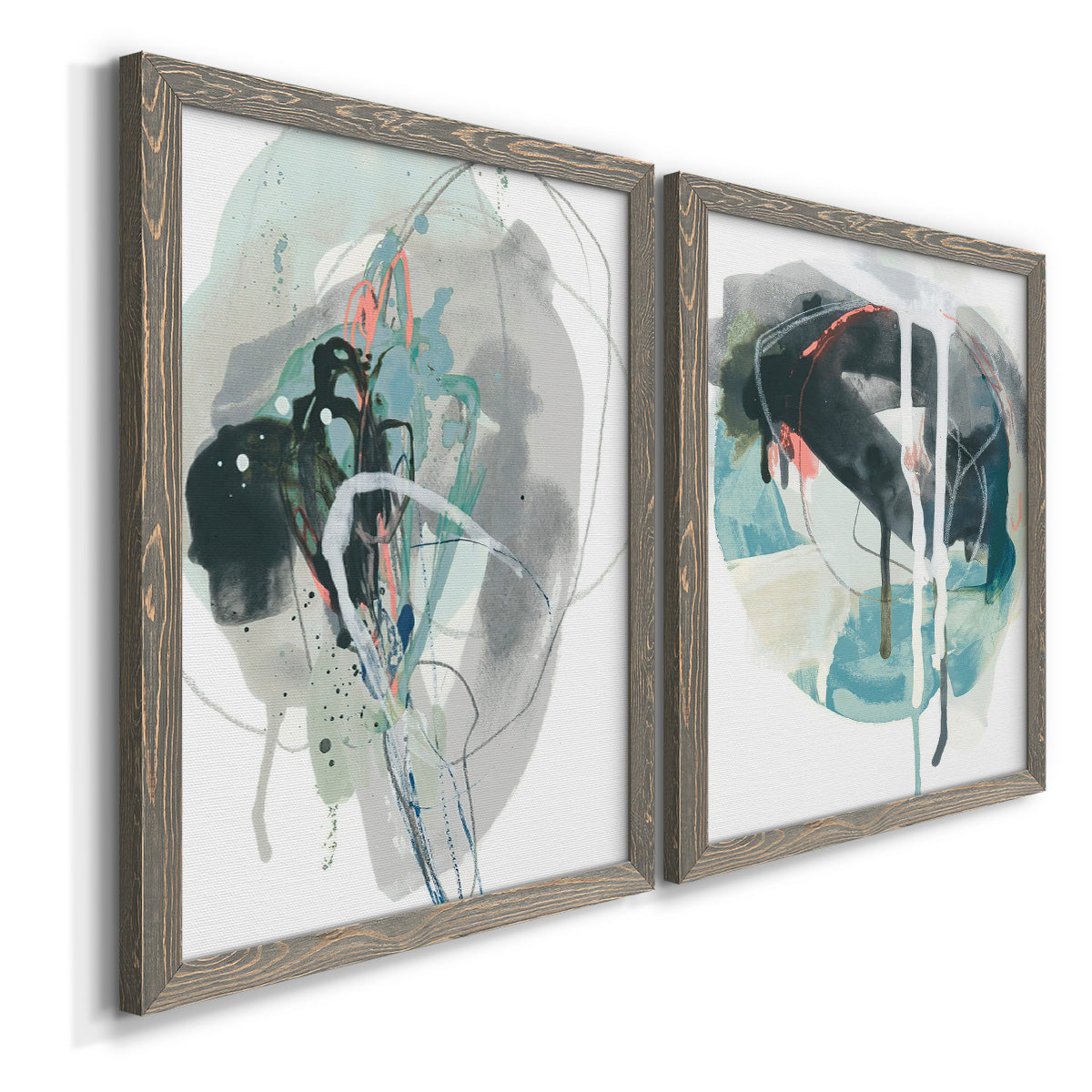 Angled view of a set of two gray barnwood framed canvas prints featuring two bold gestural abstracts featuring large black gray and teal circular gestures.