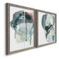 Angled view of a set of two gray barnwood framed canvas prints featuring two bold gestural abstracts featuring large black gray and teal circular gestures.