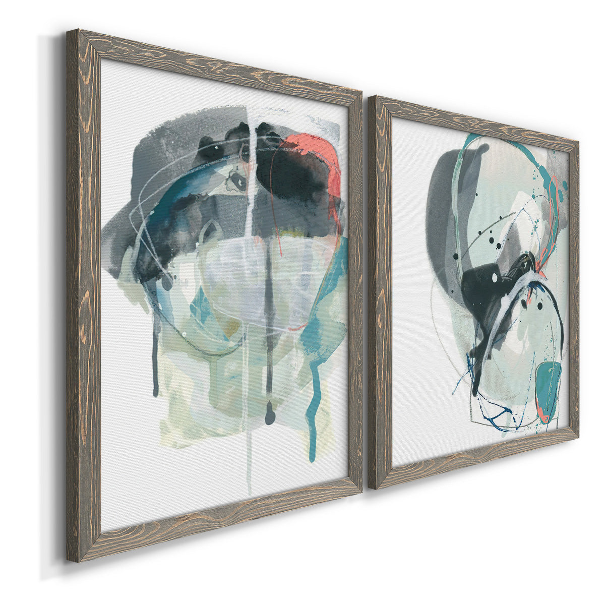 Angled view of a set of two gray barnwood framed canvas prints featuring two bold gestural abstracts featuring large black gray and teal circular gestures.