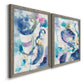 Angled view of a set of two gray barnwood framed canvas prints featuring two colorful lyrical abstracts featuring lively blue pink violet and turquoise watercolor gestures.