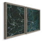 Angled view of a set of two gray barnwood framed canvas prints featuring two dramatic stone-inspired abstracts featuring dark green marble veining.