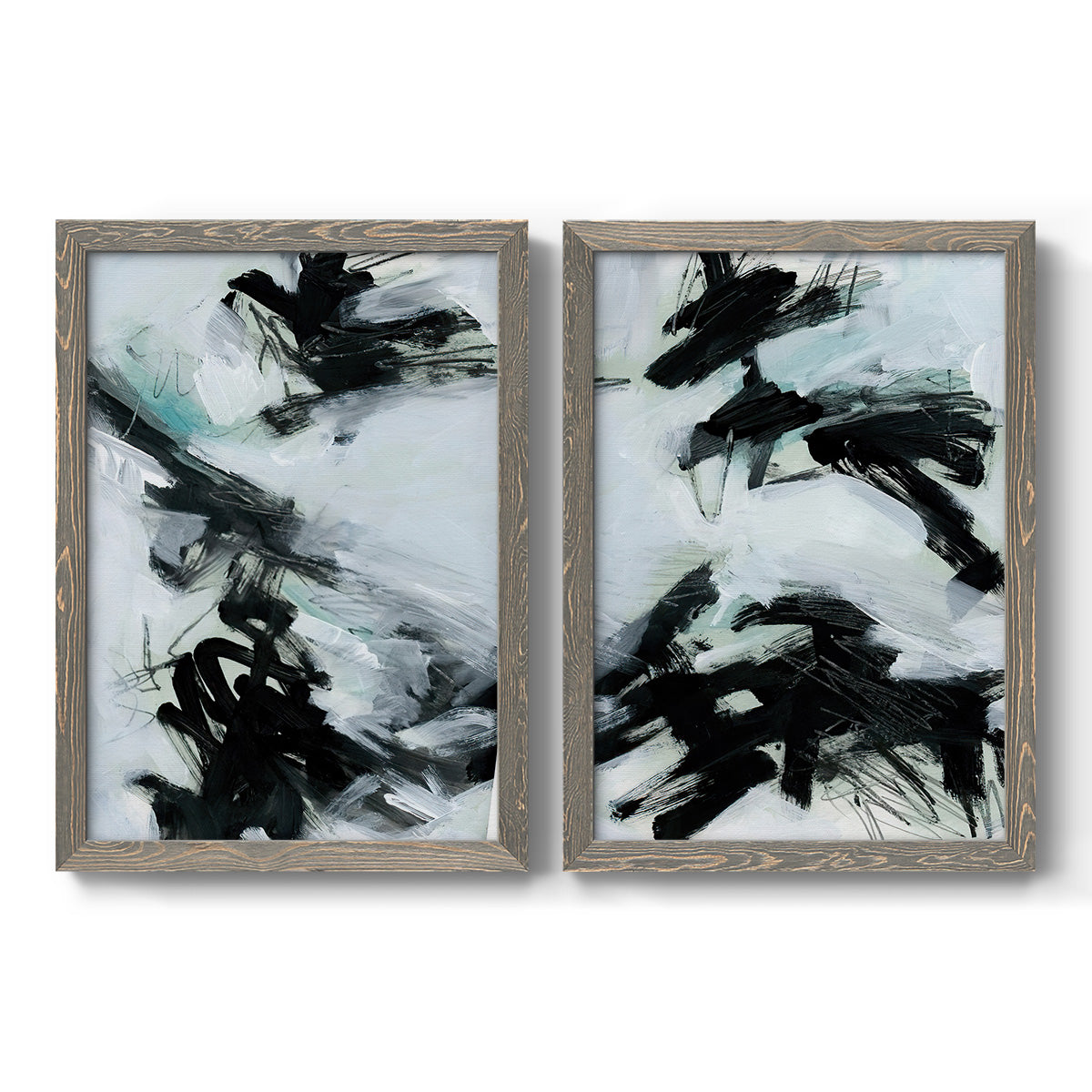 Set of two gray barnwood framed canvas prints featuring two gestural ocean-inspired abstracts featuring sweeping black brushstrokes over pale blue-gray fields.
