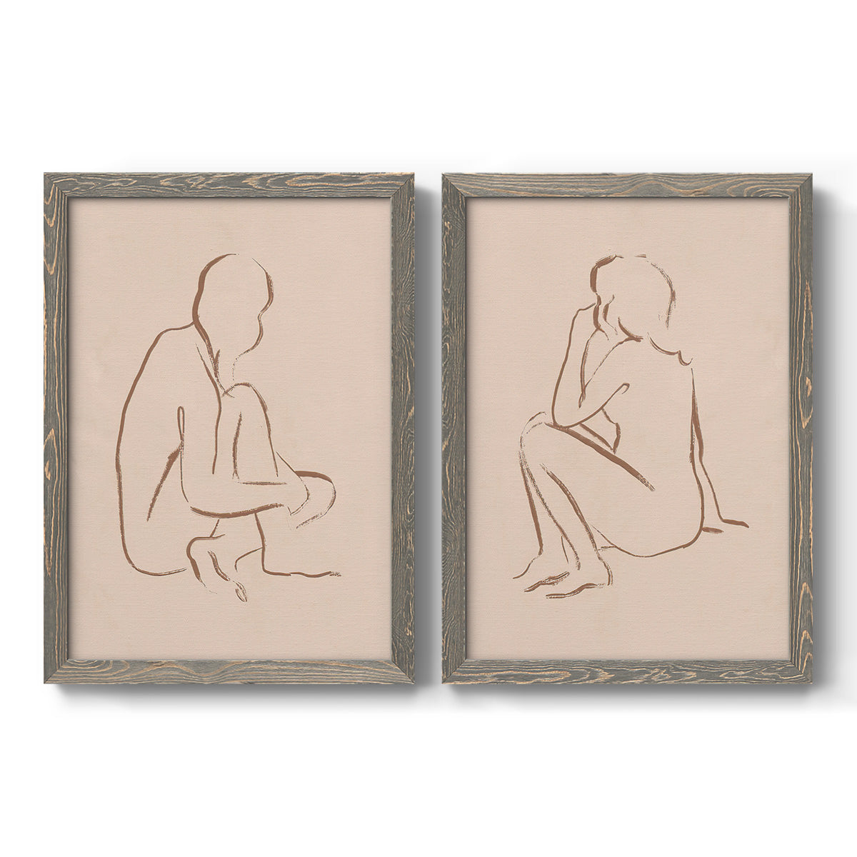Set of two gray barnwood framed canvas prints featuring two minimalist figurative sketches featuring seated female figures drawn with single flowing lines.