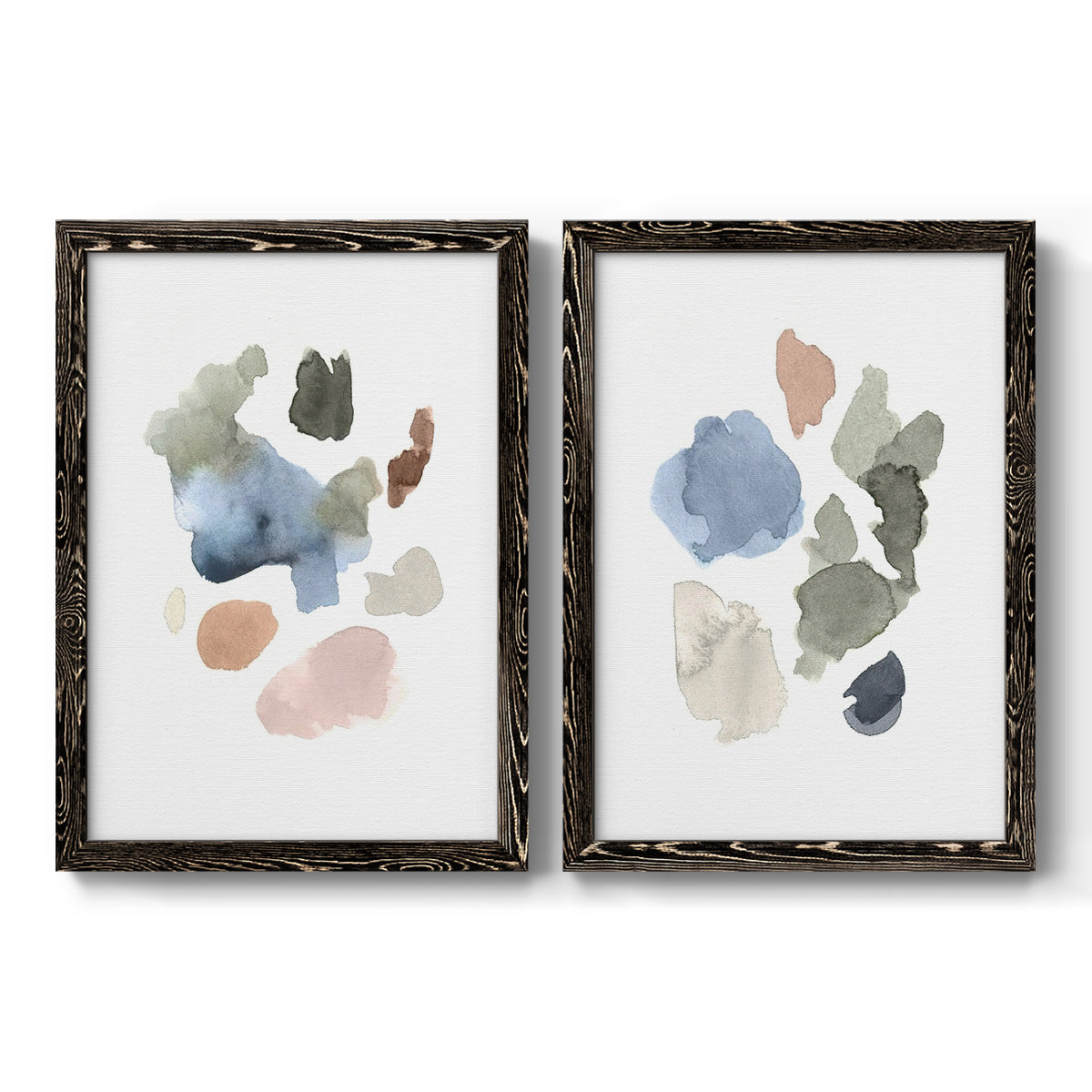 Set of two black barnwood framed canvas prints featuring two airy minimalist abstracts featuring scattered translucent watercolor shapes.