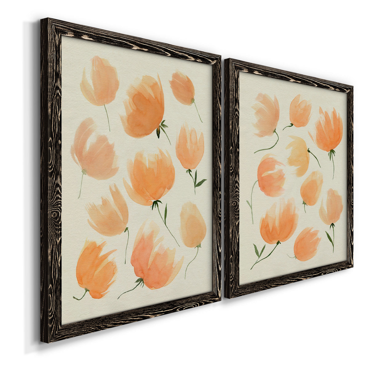 Angled view of a set of two black barnwood framed canvas prints featuring two airy watercolor floral paintings featuring loose peach-orange tulip-like blossoms.