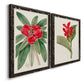 Angled view of a set of two black barnwood framed canvas prints featuring two antique botanical plate illustrations featuring vivid tropical flowering plants.