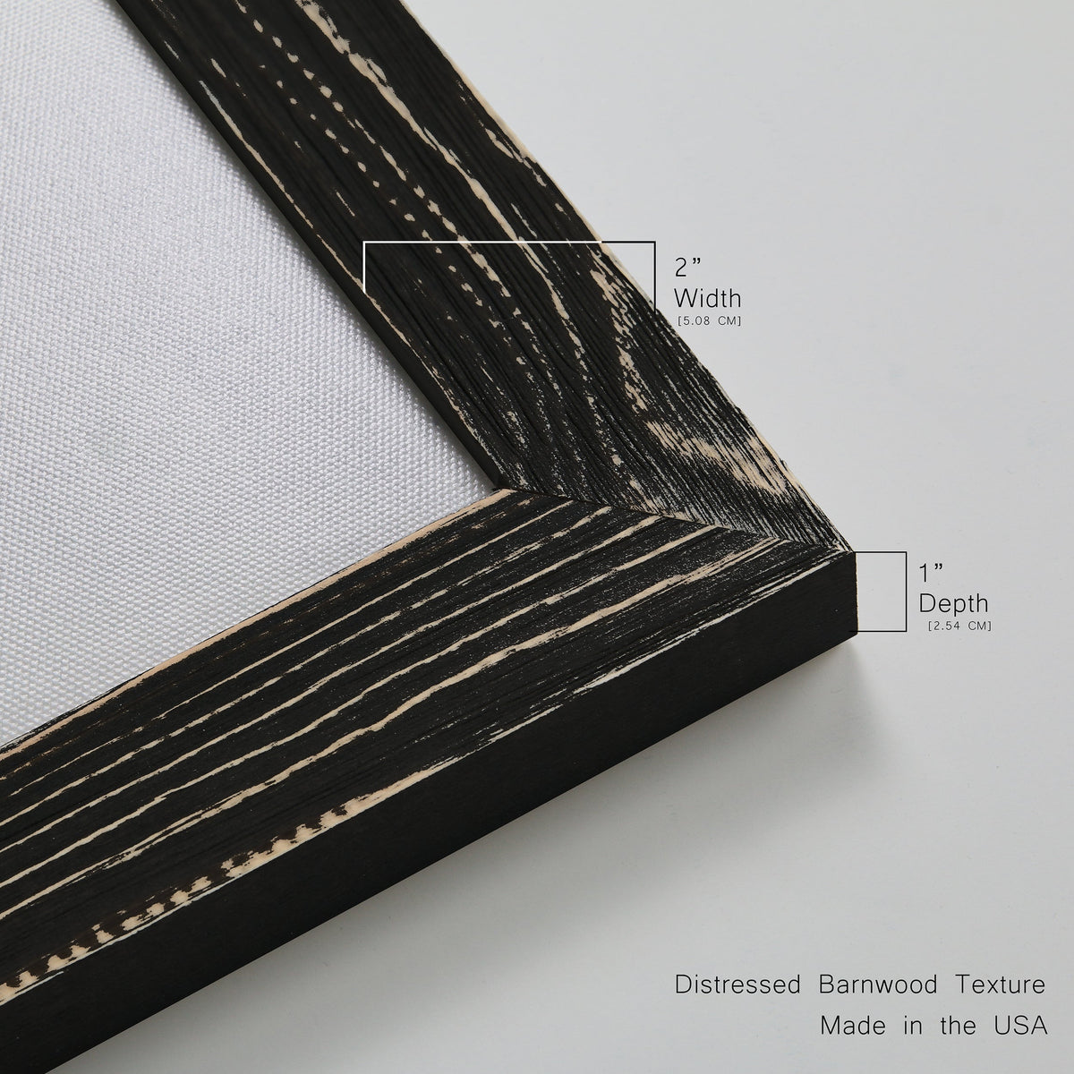 Close-up of the black barnwood frame corner and gallery-wrapped canvas construction.