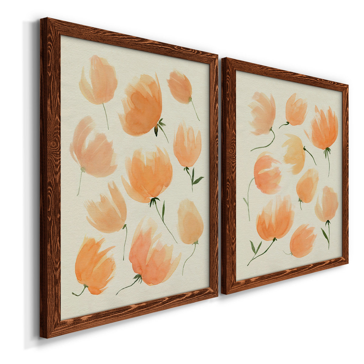Angled view of a set of two maple barnwood framed canvas prints featuring two airy watercolor floral paintings featuring loose peach-orange tulip-like blossoms.
