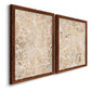 Angled view of a set of two maple barnwood framed canvas prints featuring two vintage decorative prints featuring ornate cream floral damask patterns.