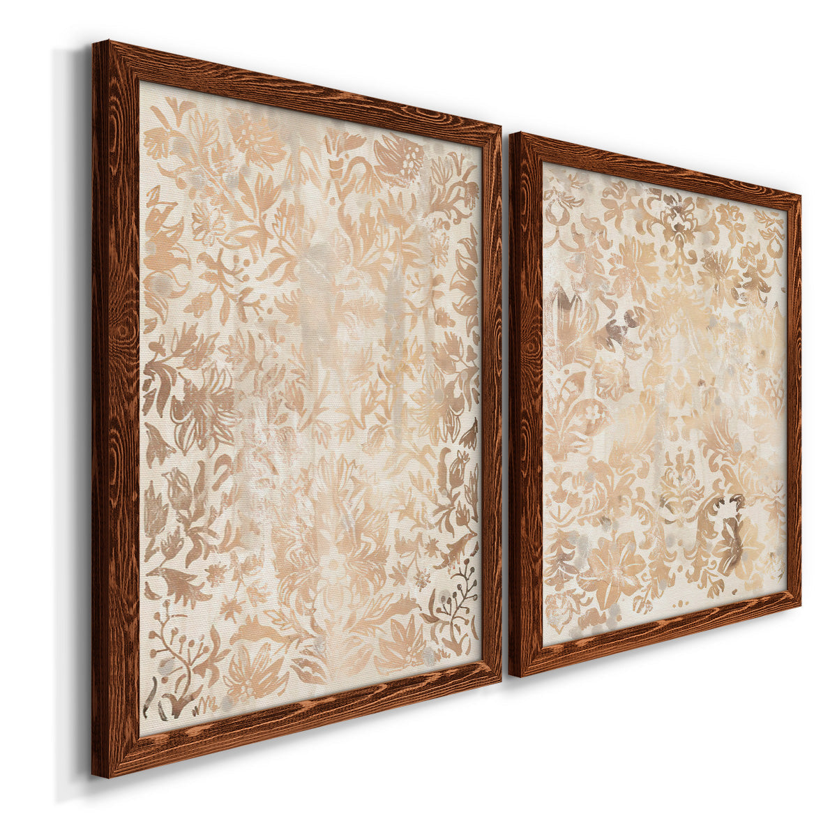 Angled view of a set of two maple barnwood framed canvas prints featuring two vintage decorative prints featuring ornate cream floral damask patterns.