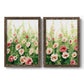 Set of two walnut barnwood framed canvas prints featuring two luminous impressionistic floral paintings featuring a field of pink coral and white flowers.