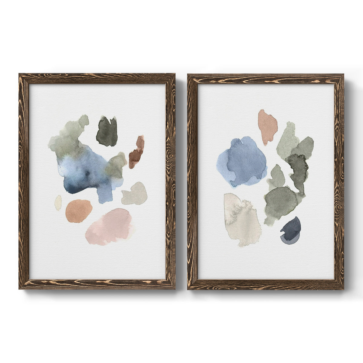 Set of two walnut barnwood framed canvas prints featuring two airy minimalist abstracts featuring scattered translucent watercolor shapes.