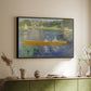 Black floater framed canvas of The Skiff (La Yole), 1875 by Pierre-Auguste Renoir, featuring an impressionist boating scene with people relaxing in a narrow skiff above a sideboard in a softly lit hallway.