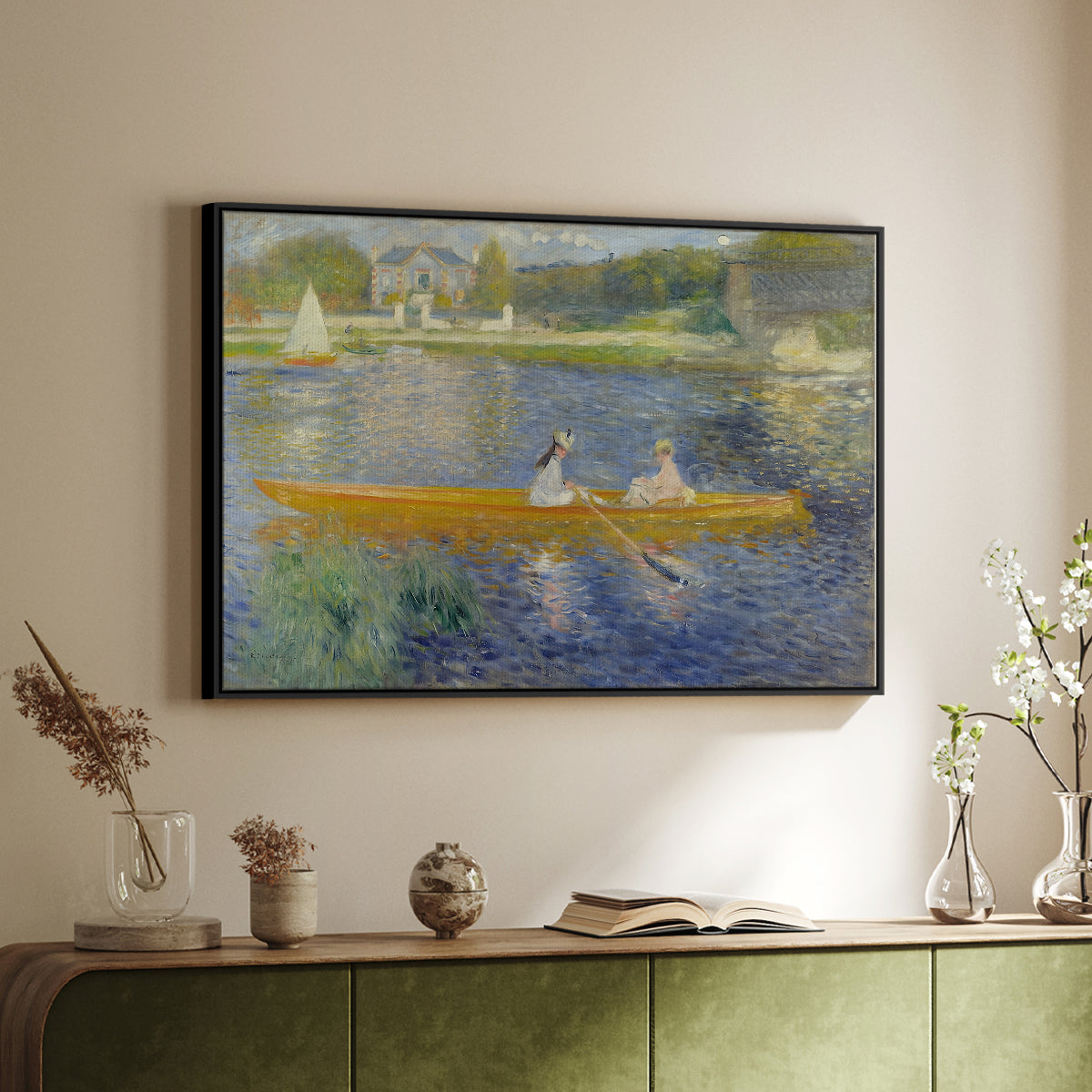 Black floater framed canvas of The Skiff (La Yole), 1875 by Pierre-Auguste Renoir, featuring an impressionist boating scene with people relaxing in a narrow skiff above a sideboard in a softly lit hallway.