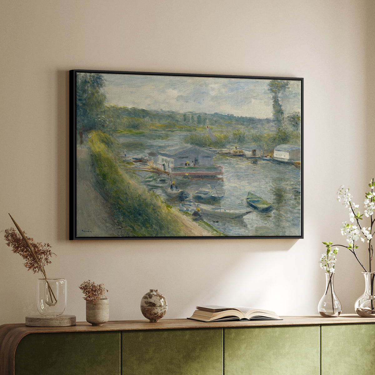 Black floater framed canvas of Wash-House Boat at Bas-Meudon, c. 1874 by Pierre-Auguste Renoir, featuring a riverside scene with moored boat used for washing clothes above a sideboard in a softly lit hallway.