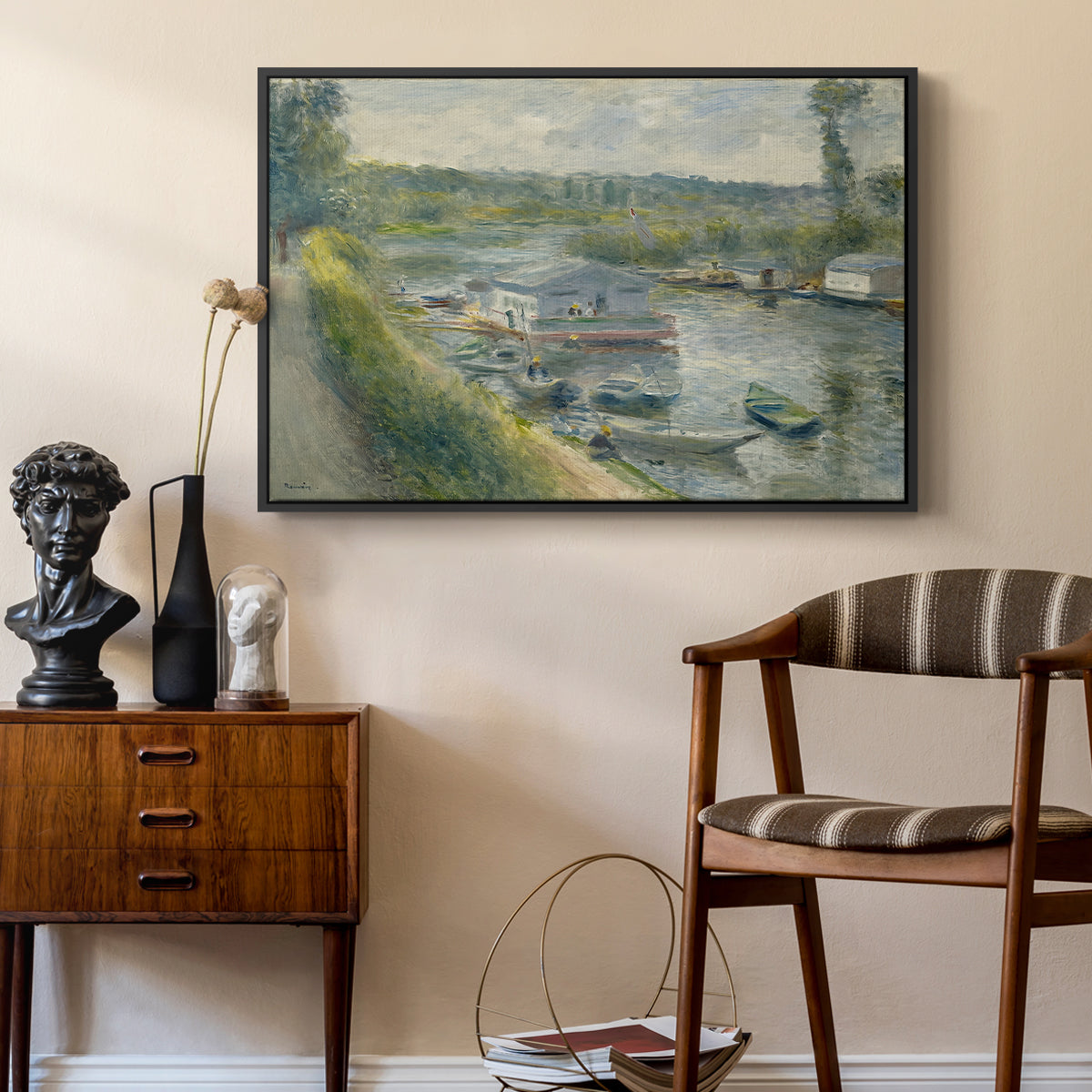 Wash-House Boat at Bas-Meudon, c. 1874 by Pierre-Auguste Renoir as a black floater framed canvas featuring an impressionist depiction of working boat along calm waterway, styled above a mid-century console in a contemporary living area.