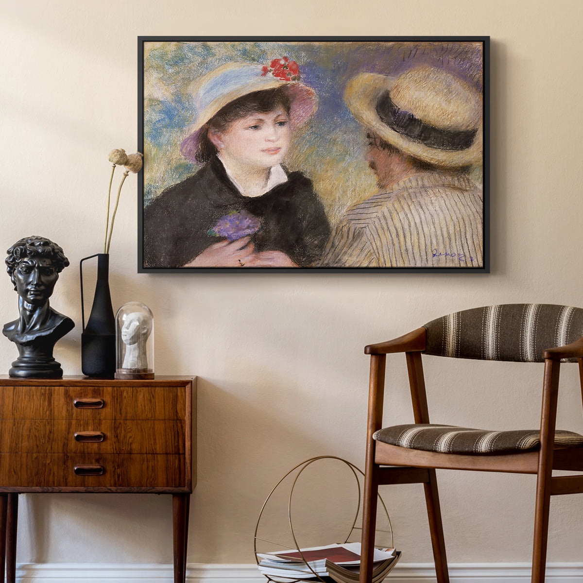 Boating Couple (Aline Charigot and Renoir), c. 1881 by Pierre-Auguste Renoir as a black floater framed canvas featuring an impressionist depiction of couple enjoying leisure time near water, styled above a mid-century console in a contemporary living area.