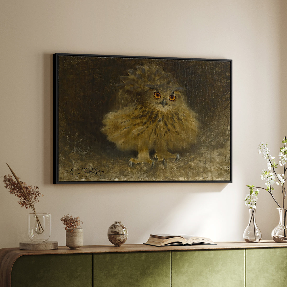 Black floater framed canvas of An Eagle Owl (Berguv), 1905 by Bruno Liljefors, featuring a detailed wildlife painting of eagle owl with piercing eyes in darkness above a sideboard in a softly lit hallway.