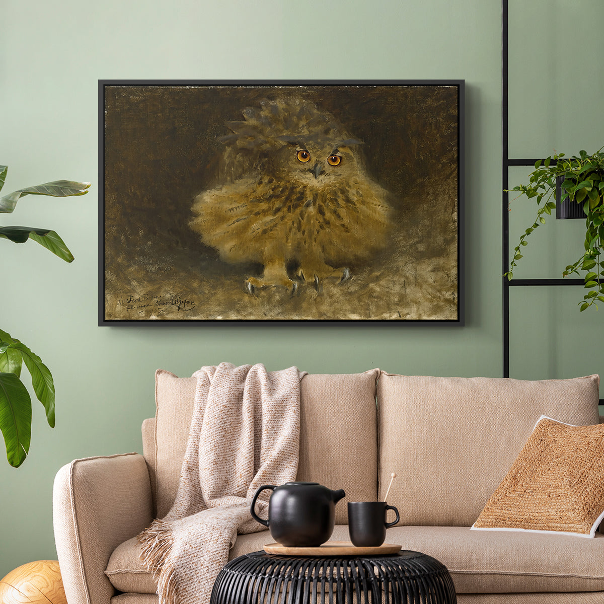 Black floater framed canvas featuring a realistic depiction of owl camouflaged within woodland environment, displayed above a sofa in a modern living room.