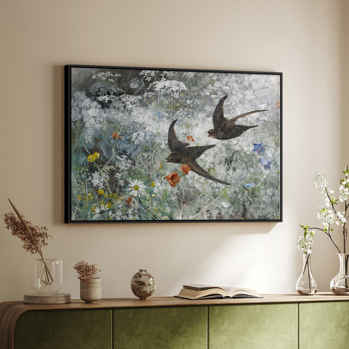 Black floater framed canvas of Common Swifts, 1886 by Bruno Liljefors, featuring swifts gliding midair with wings spread against soft sky above a sideboard in a softly lit hallway.