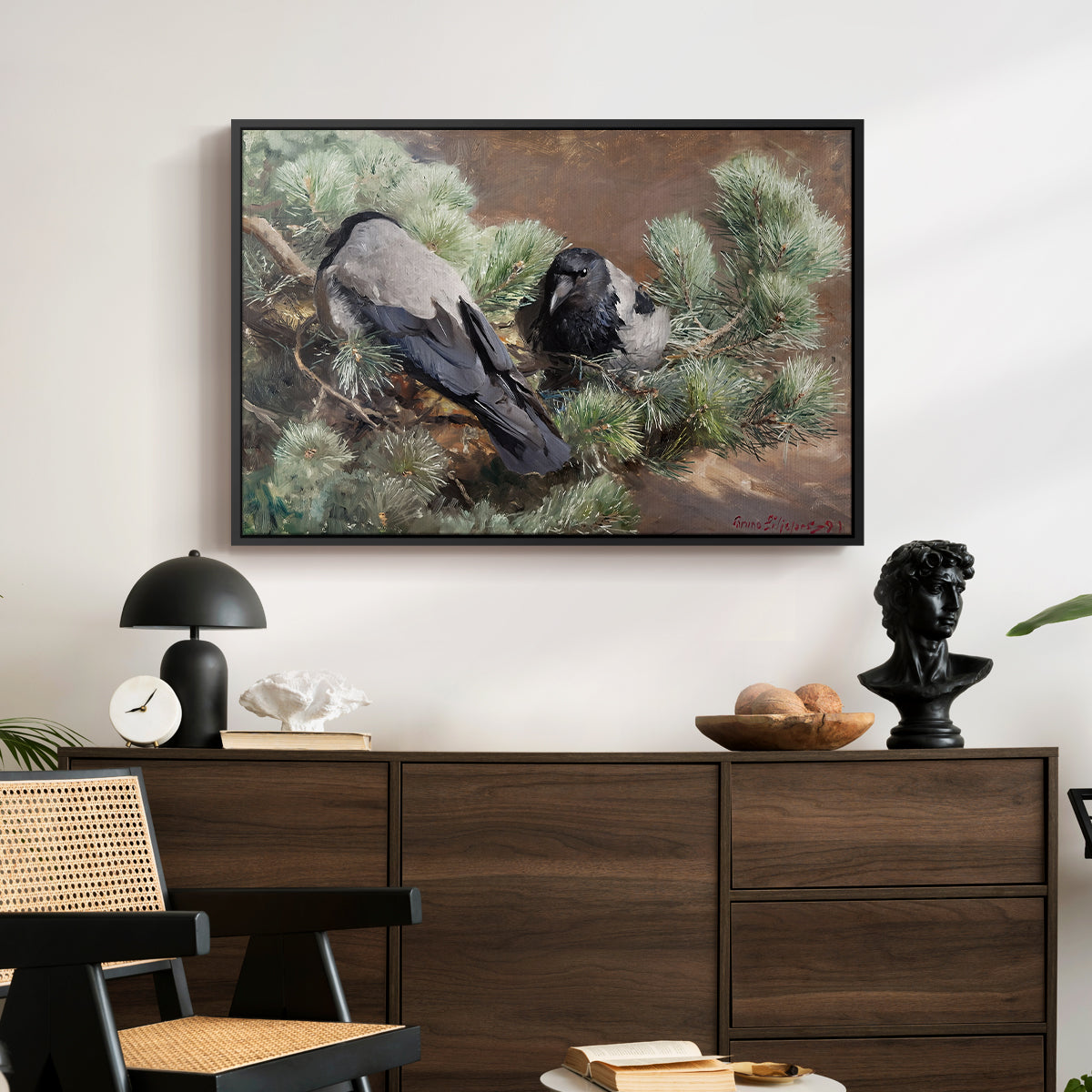 Hooded Crows (Kråkor), 1891 by Bruno Liljefors displayed in a black floater framed canvas above a dark wood credenza in an entryway.