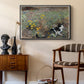 Cat on a Flowery Meadow, 1887 by Bruno Liljefors as a black floater framed canvas featuring an animal scene of cat hidden in lush meadow vegetation, styled above a mid-century console in a contemporary living area.