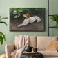 Black floater framed canvas featuring a calm scene of dog reclining in open landscape, displayed above a sofa in a modern living room.