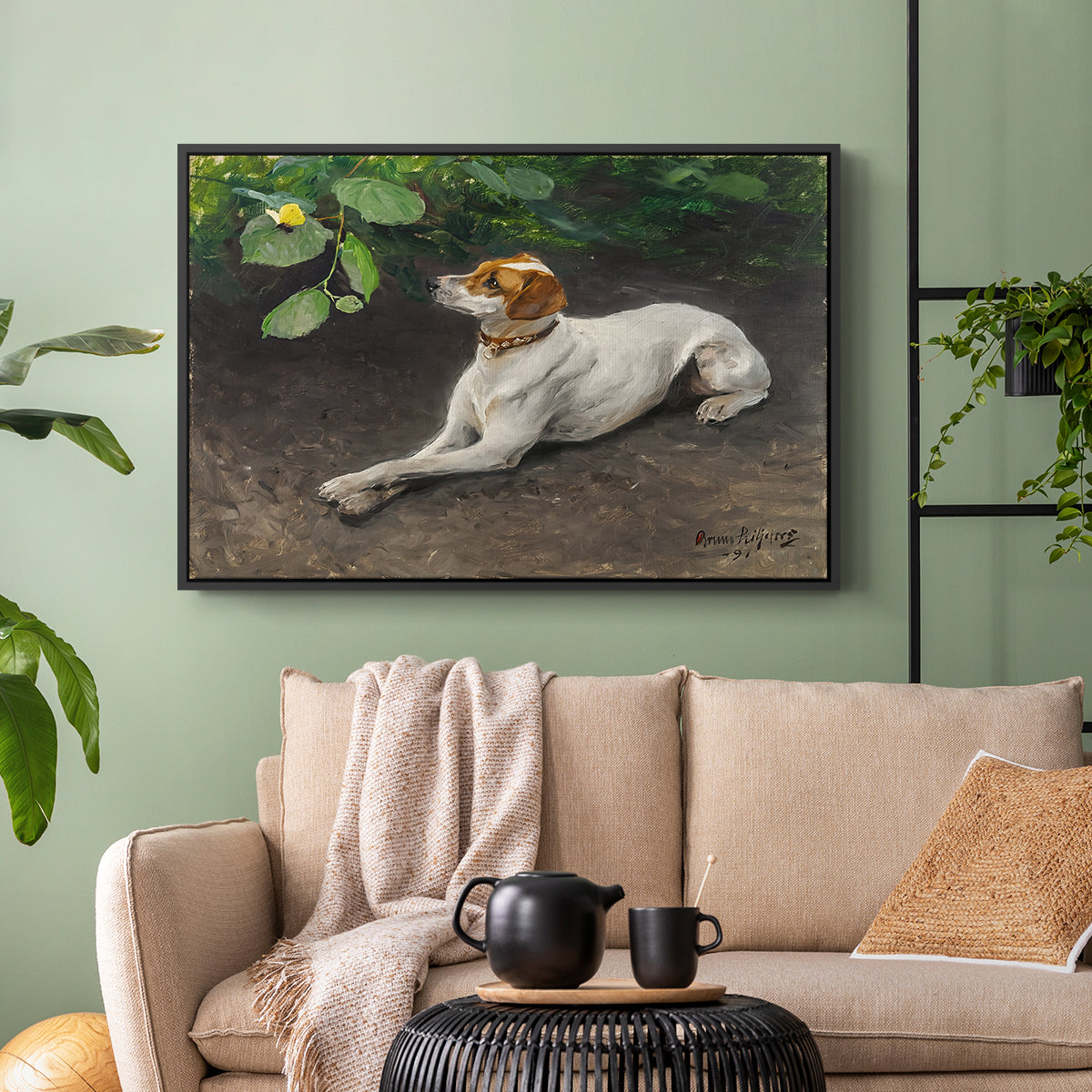 Black floater framed canvas featuring a calm scene of dog reclining in open landscape, displayed above a sofa in a modern living room.