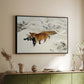 Black floater framed canvas of Fox in Snow Landscape, 1900 by Bruno Liljefors, featuring a wildlife scene of fox moving swiftly through winter terrain above a sideboard in a softly lit hallway.