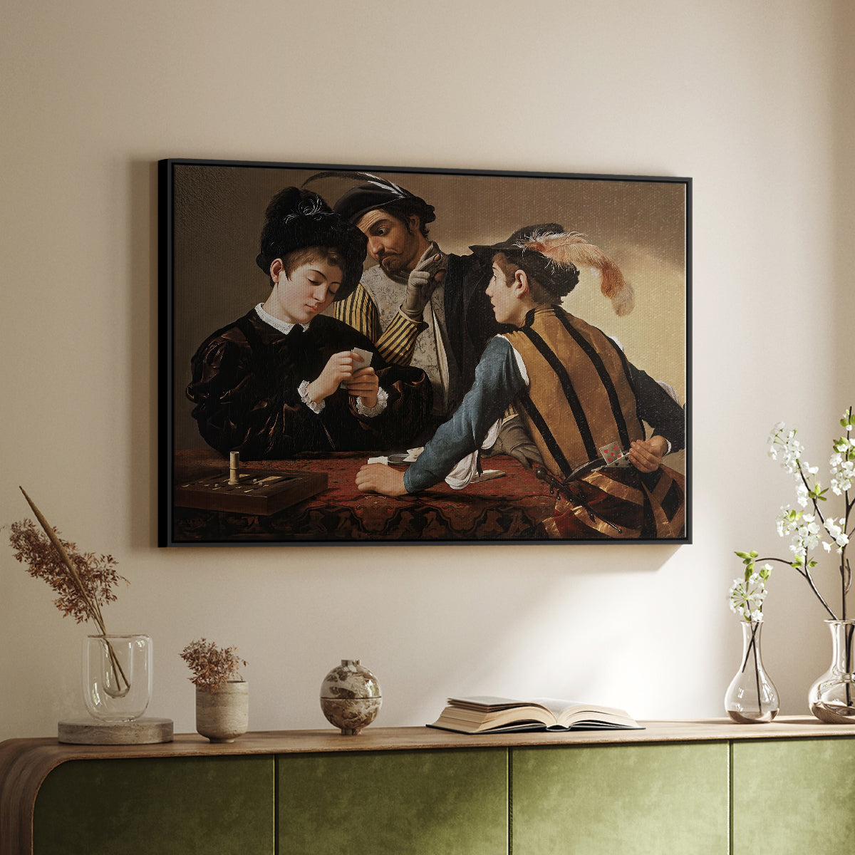 Black floater framed canvas of The Cardsharps, c. 1594 by Caravaggio, featuring a genre scene of card game with deception and hidden accomplice above a sideboard in a softly lit hallway.