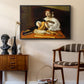 The Lute Player (Wildenstein Version), c. 1596 by Caravaggio as a black floater framed canvas featuring a detailed scene of youth playing string instrument with fruit and flowers nearby, styled above a mid-century console in a contemporary living area.