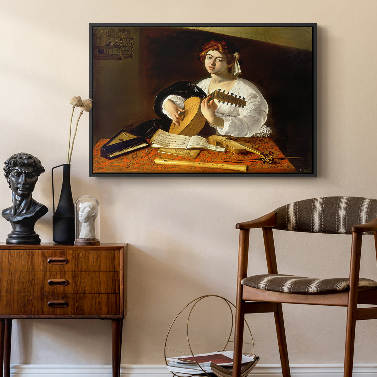 The Lute Player (Wildenstein Version), c. 1596 by Caravaggio as a black floater framed canvas featuring a detailed scene of youth playing string instrument with fruit and flowers nearby, styled above a mid-century console in a contemporary living area.