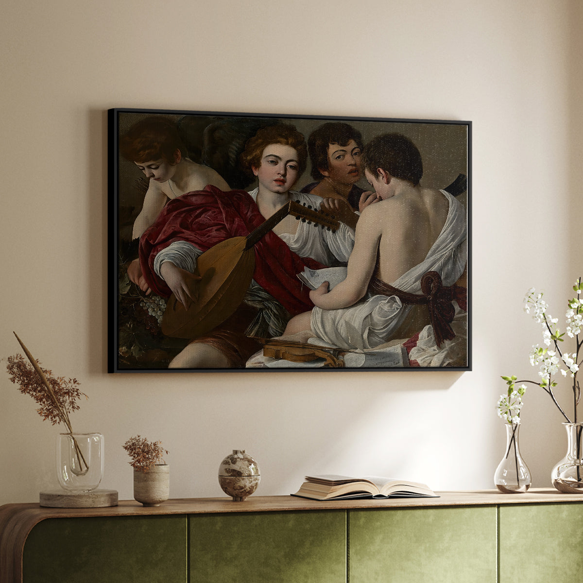 Black floater framed canvas of The Musicians, c. 1595 by Caravaggio, featuring an ensemble of musicians holding lute and singing in close arrangement above a sideboard in a softly lit hallway.