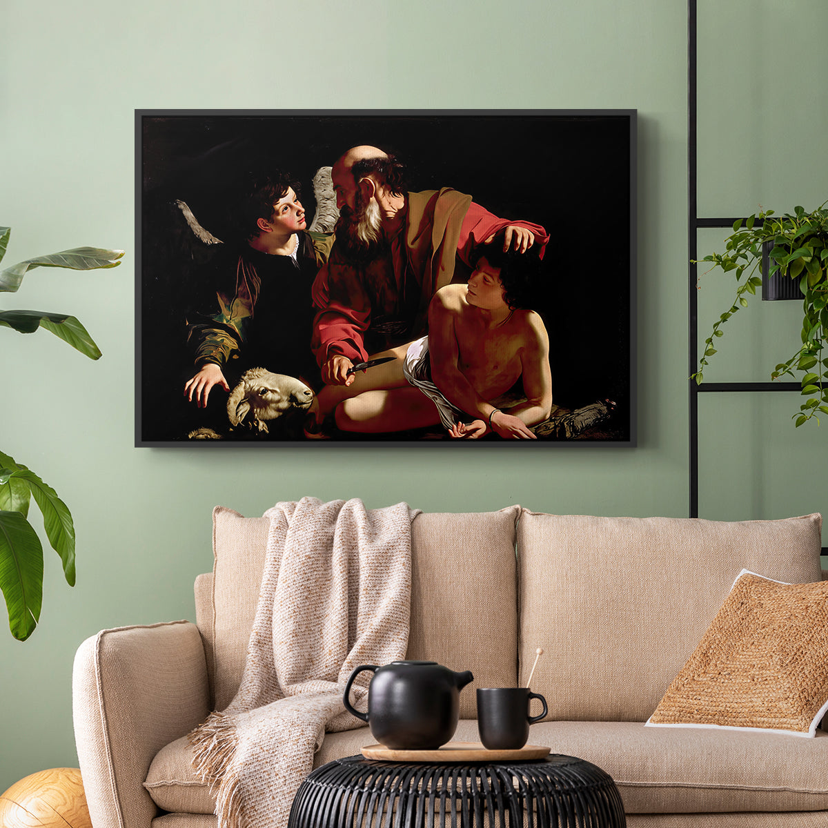 Black floater framed canvas featuring an intense religious narrative with figures in close physical struggle, displayed above a sofa in a modern living room.