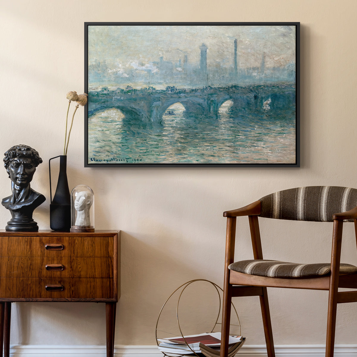 Waterloo Bridge, Gray Weather, 1900 by Claude Monet as a black floater framed canvas featuring a soft-toned river scene with bridge and muted skyline, styled above a mid-century console in a contemporary living area.