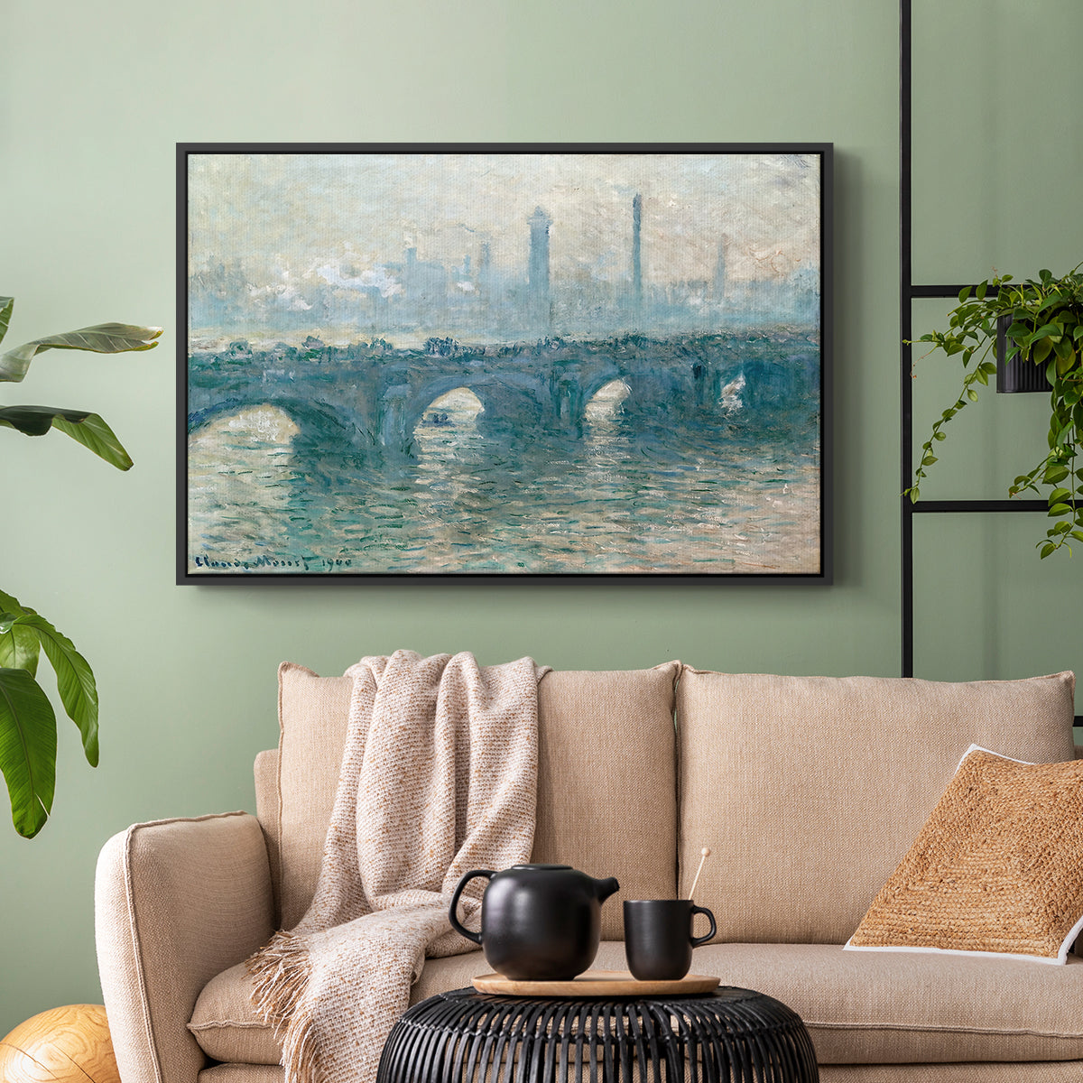 Black floater framed canvas featuring an atmospheric urban landscape with misty light and reflections, displayed above a sofa in a modern living room.