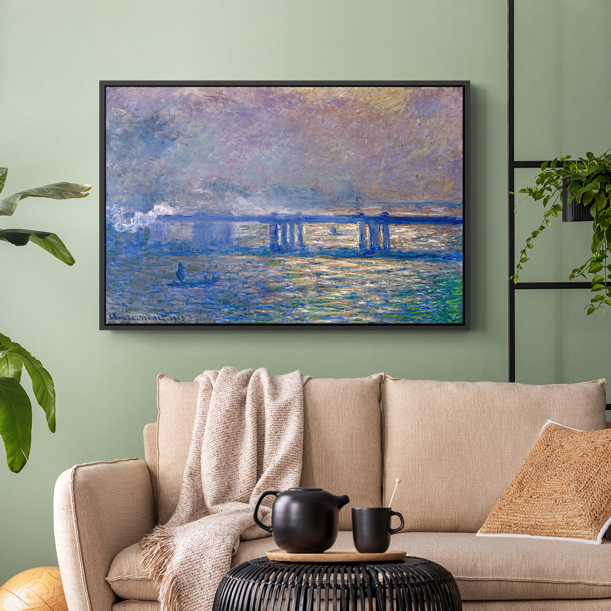 Black floater framed canvas featuring a city bridge scene softened by mist and impressionist brushwork, displayed above a sofa in a modern living room.